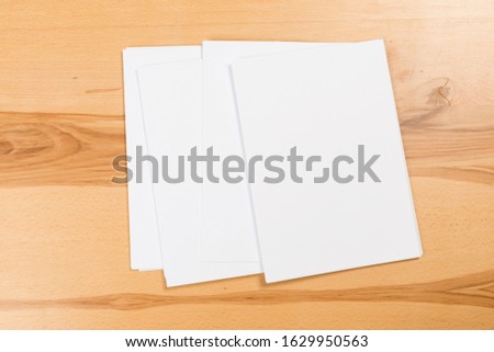 Top view of modern desk office workplace with  a4 paper. Blank branding template. Photo blank form. Mock up for portfolio design.