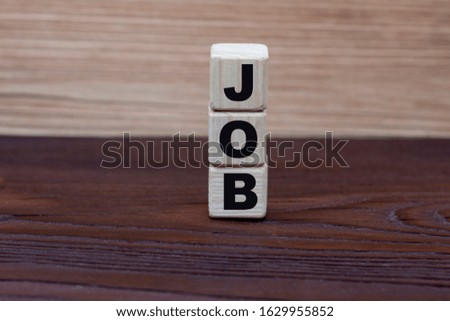 concept word job on cubes on a beautiful wooden background