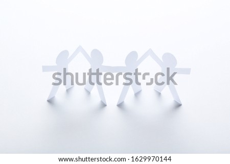 Paper chain people on white background