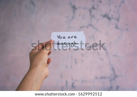 Motivation and inspirational quotes - You are enough. Blurry background. Royalty-Free Stock Photo #1629992512