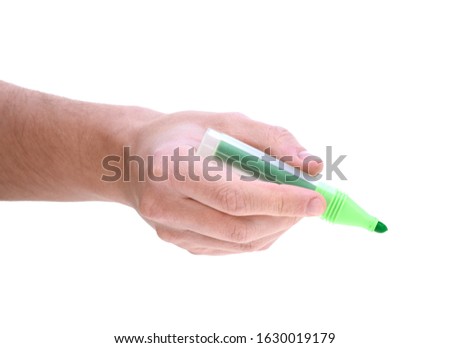 Male hand with green marker pen isolated on white background