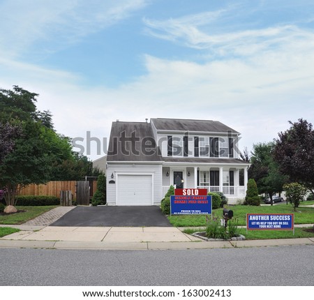 Sold Real Estate Another Success Let Us Help you Buy Sell Your Next Home Sign Front yard Lawn Suburban Home Residential Neighborhood USA Blue Sky Clouds