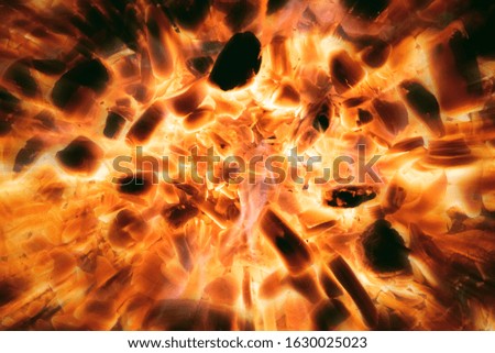 Fire blast. Hot burning coal close up abstract background.
