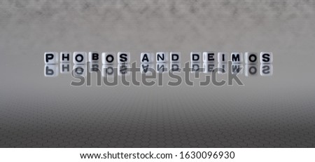 phobos and deimos concept represented by wooden letter tiles Royalty-Free Stock Photo #1630096930