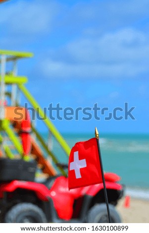 Beautiful National Flag of Switzerland on Tropical Beach
