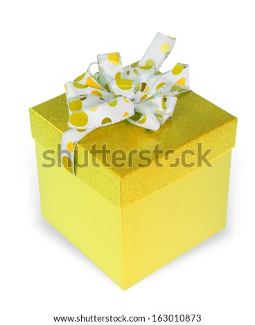 Yellow gift box with sparkly lid and polka dot ribbon and bow isolated on white