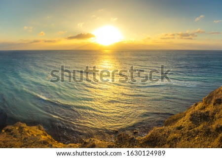Dawn on the sea coast against the backdrop of nature