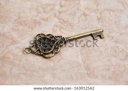 Vintage key on paper background