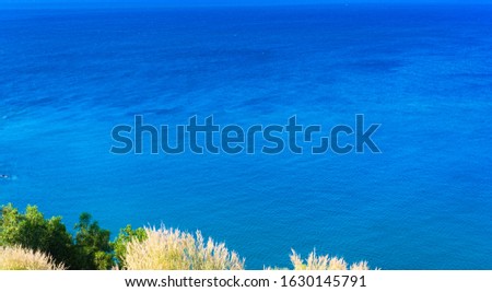 Sea view from tropical blue sea sky with sunny sky.Summer paradise sea of Phuket island.Tropical sea in Phuket.Exotic summer beach with clouds on horizon.Ocean beach relax,Vacation,Outdoor travel.