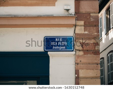 Rue des Juifs Judegaas translated as Jewish people street in central Strasbourg street signage