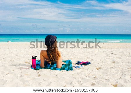 paradise summer vacation happiness carefree happy woman relaxing sitting in sand enjoying tropical beach destination. 