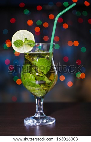Tasty cocktail on bright background