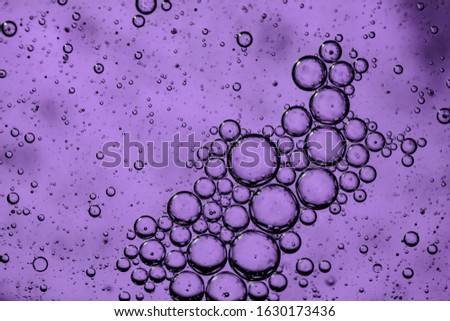 Purple Abstract background. Bubbles of water and oil.