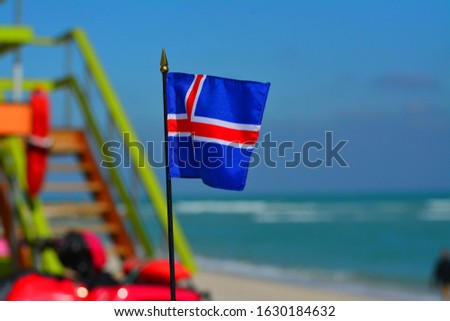 Beautiful National Flag of Iceland on Tropical Beach