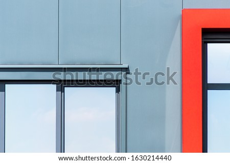 A modern colorful building with windows under the sunlight - a cool picture for backgrounds