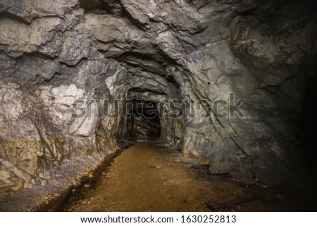 Old mica ore mine underground tunnel Royalty-Free Stock Photo #1630252813