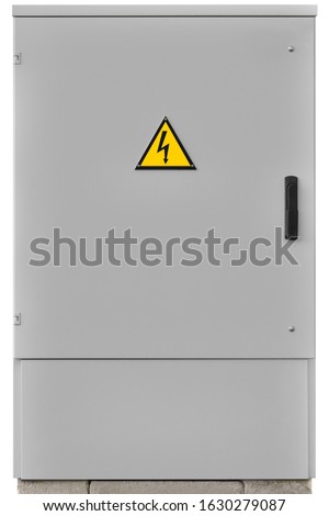 Power distribution wiring switchboard panel outdoor unit grey brand new distributing board compartment box gray cabinet yellow high voltage warning triangle sign large vertical isolated closeup