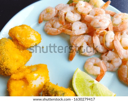 Fresh delicious boiled peeled shrimp. Cooked seafood. Broccoli and shrimp