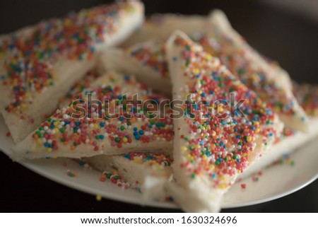 a Close up plate of fairy bread, Australian party food bread buttered and then sprinkled with sprinkles Royalty-Free Stock Photo #1630324696