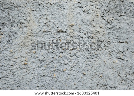 gray concrete wall, stucco, rough stone, with holes and irregularities