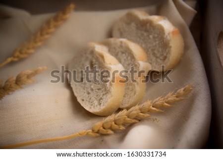 Bakery. Dry bread, slices of bread, bread sticks and wheat branches, on a linen napkin. Close up and depth of field