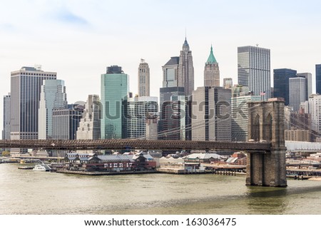 New York City Brooklyn Bridge with downtown skyline over East River