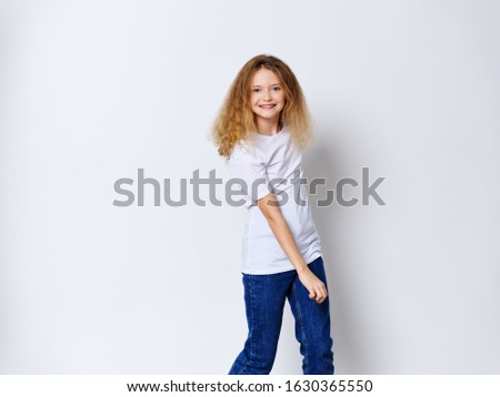 Curly hair blonde happy girl child play positive schoolgirl posing fashion hairstyle