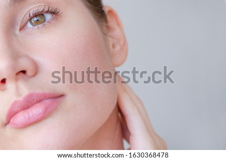 
face skin of a beautiful girl with pores closeup Royalty-Free Stock Photo #1630368478