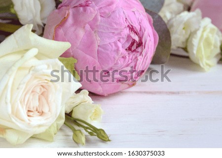 Delicate romantic bouquet for a gift. Huge pink peonies and white roses on a white background. Flower arrangement for Valentine's Day, Mother's Day or International Women's Day. 