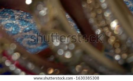 Blurred abstract photo of light burst and glitter golden bokeh lights. As Background.