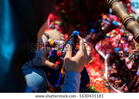 photographs focused on the hands of people making crafts