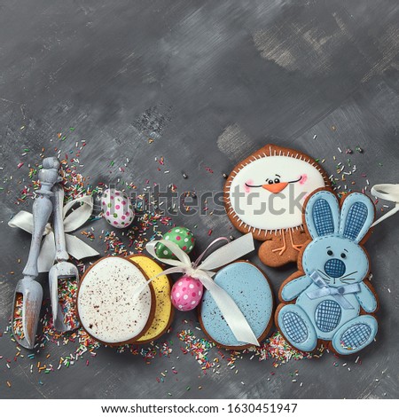 Easter cookies on gray background. Greeting Easter background. Top view with free copy space