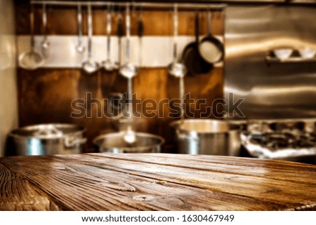 table background of free space for your decoration and blurred background of interior kitchen.Copy space for your products and sunny day. 