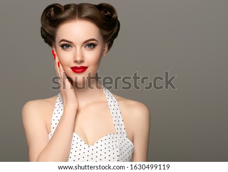 Pin up vintage woman model hairstyle red lips manicured hands nails