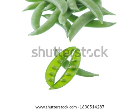 Fresh green snap peas isolated on white