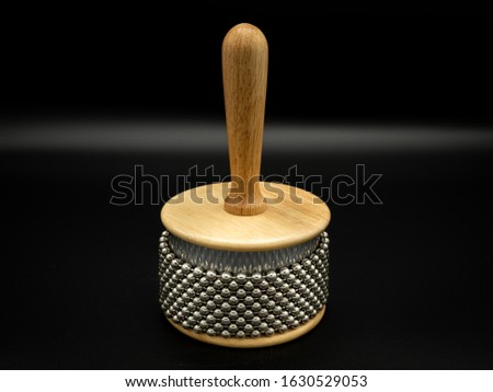 Closeup of a cabasa in front of black background