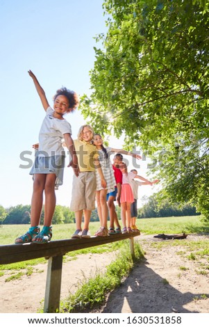 Kids balance for fitness and agility in the park in summer Royalty-Free Stock Photo #1630531858
