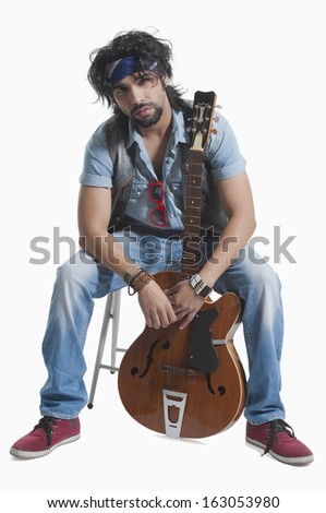 Musician holding a guitar