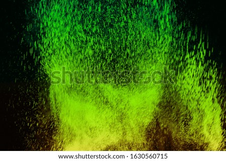 color powder explosion cloud isolated on black background. Freeze motion of color dust particles splashing. 