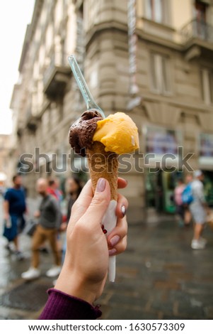 hand holding italian ice cream