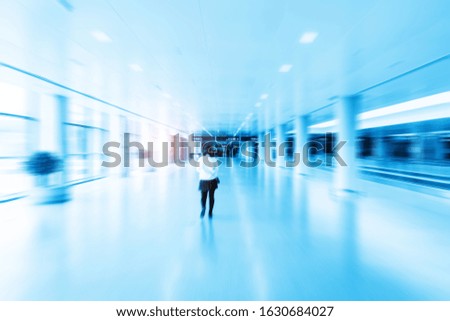 Blue style dynamic blur of the departure hall passage