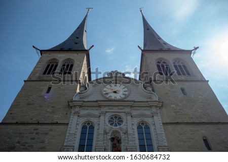 Beautiful medieval christ church on clear blue sky background , copy space , Luzern , Switzerland