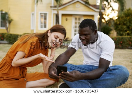 beautiful african american and female model chatting outdoors