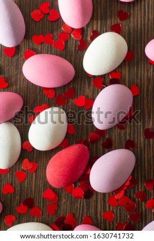 Flat Lay of multi-color Easter Eggs Pattern on wooden background. Easter background or easter concept. Happy Easter