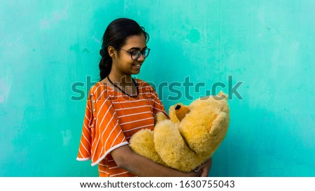 Young teenager girl with teddy bear