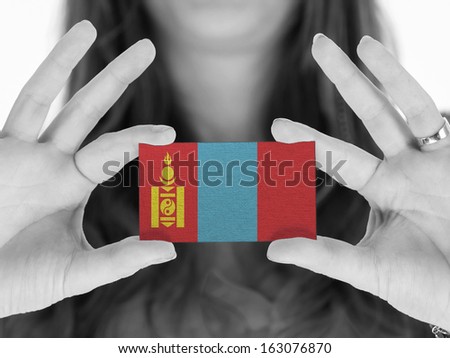 Woman showing a business card, flag of Mongolia