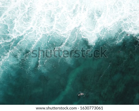 Blue Hawaiian Ocean From Above with waves and surfers