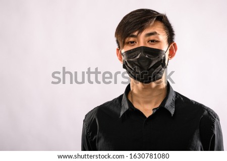 Concept of coronavirus quarantine. MERS Cov middle East respiratory syndrome coronavirus, Novel coronavirus 2019nCoV, Asian man with medical face mask Royalty-Free Stock Photo #1630781080