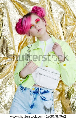 young woman with beautiful bright hair looking at the camera