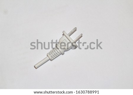 The electrical plug is used to plug in a white background.